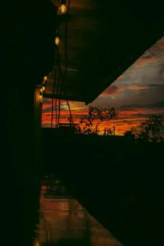 Sunlight getting through the clouds and mountains at sunset Foto stock