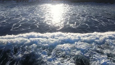 Sunlight glaring on the ocean waves as they break. Stock-Footage 162082213