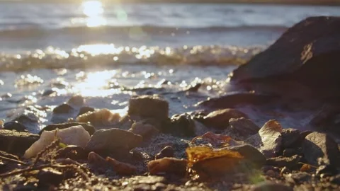 Sunlight Glinting on Water and Rocks at Sunset on the Southern Urals Shore Stock Footage 325466100