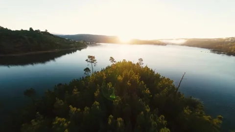 Sunlight glints off rippling lake waters at Castelo de Bode Stock Footage 342268231