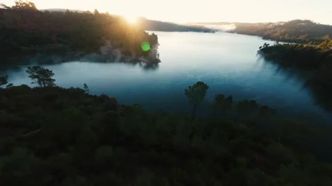 Sunlight glints off rippling lake waters at Castelo de Bode Stock Footage 342268337