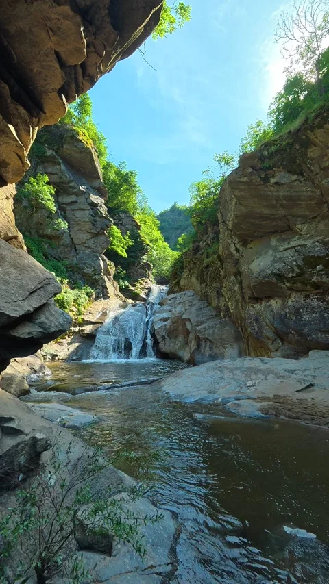 Sunlight glints off rocky surfaces. Vucjanka Canyon, Serbia. Vertical Stock Footage 341131110