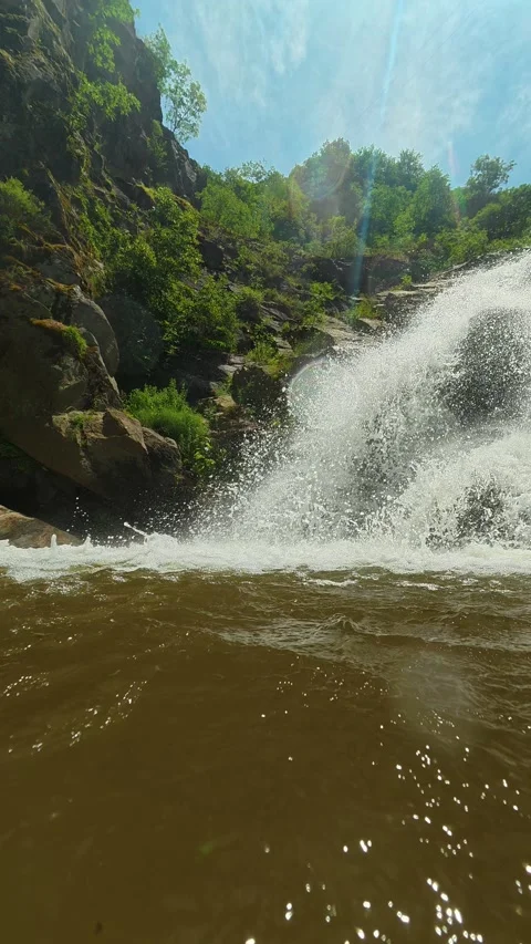 Sunlight glints off rushing water. Vucjanka Canyon, Serbia. Vertical Stock Footage 341130800