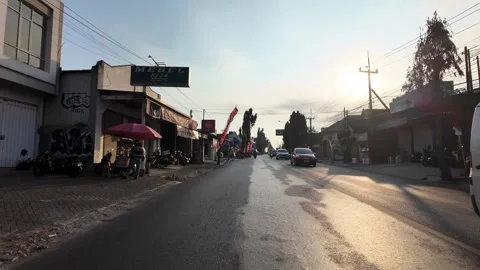 Sunlight glints off wet road surface Stock Footage 345147612