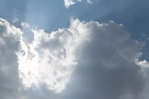 Sunlight Glowing Behind Thick Clouds Stock Photos
