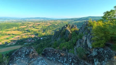 Sunlight glows over ancient stone peaks. Boracki krs Serbia 動画素材 345004864