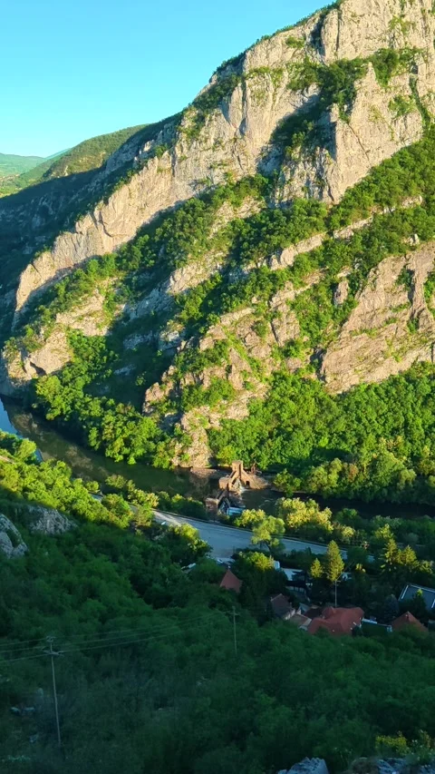 Sunlight glows through wooden planks. Sicevo Gorge, Serbia. Vertical Stock Footage 337057997