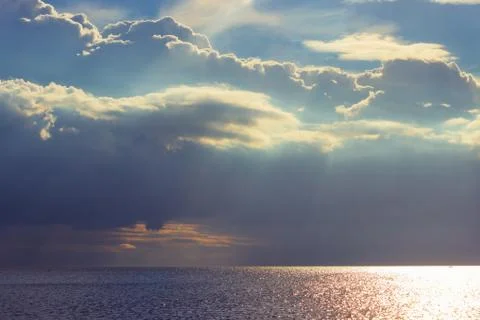 Sunlight goes through the clouds over the Baltic sea Foto stock