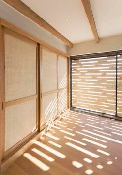 Sunlight on hardwood floors in modern, luxury home showcase interior Stock Photos