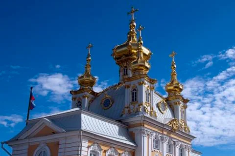 Sunlight highlighting palace rooftop decorations Stock Photos