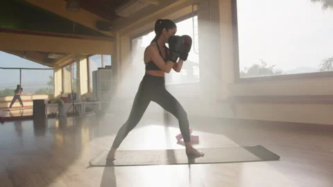 Sunlight Hitting A Woman Training With Boxe Gloves Stock Footage 278477145