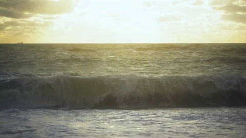 Sunlight illuminates the coastal wave slow motion Stock Footage 82170758