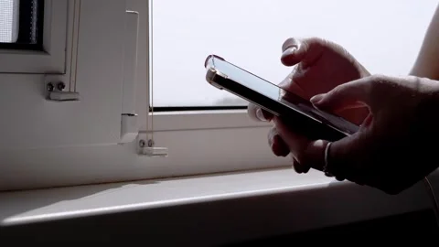 Sunlight Illuminates Womans Hands Using Smartphone Stock Footage 316177516