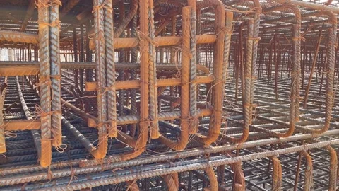 Sunlight into the lens. Rebar texture. Stock Footage 236207320