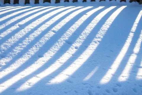 Sunlight lines on snow Stock Photos