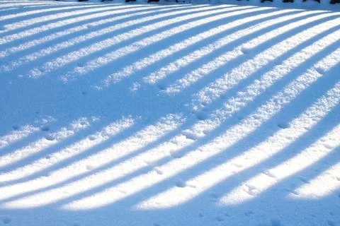 Sunlight lines on snow Stock Photos