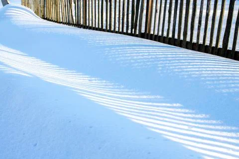 Sunlight lines on snow Stock Photos
