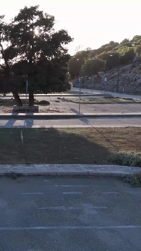 Sunlight is moving across an empty driving school training area Stock Footage 290451023