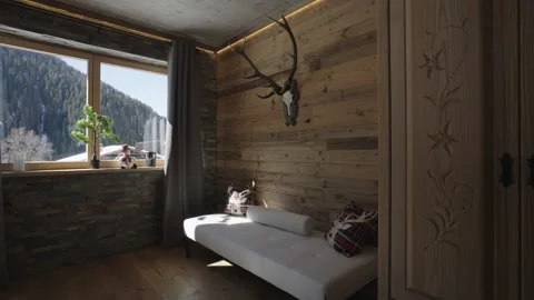 Sunlight moving across a rustic mountain cabin bedroom with wood paneling and a Stock Footage 335757003