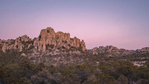 Sunlight moving on a rock mountain in desert time lapse Video stock 148606449