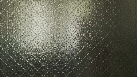 Sunlight or artificial light creating subtle bokeh and distorted reflections Stock Footage 346410219
