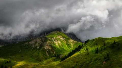 Sunlight over the mountains and clouds in the sky Stock Photos