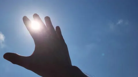 Sunlight passing through fingers Video stock 219710505