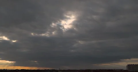 Sunlight passing through sky. Dark clouds during sunset. Timelapse. Stock Footage 252936921