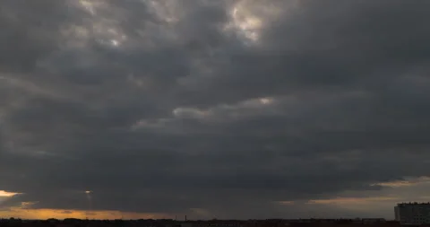 Sunlight passing through sky. Dark clouds and sun rays during sunset. Timelapse. Stock Footage 252937383