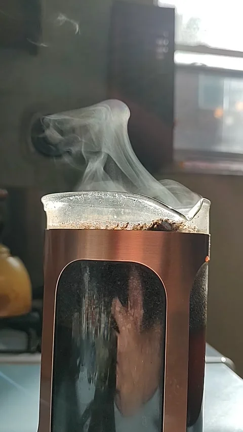 Sunlight Passing Through Steam Rising from Coffee Carafe - morning, vertical 01 Stock Footage 287348791