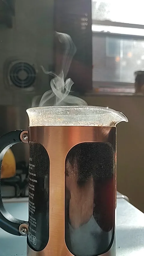 Sunlight Passing Through Steam Rising from Coffee Carafe - morning, vertical 02 Stock Footage 287348797