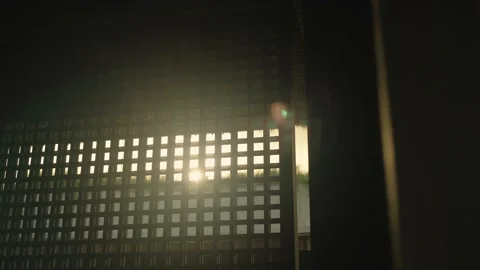 Sunlight passing through wooden square frame, tiny openings, light rays, Video stock 160945533