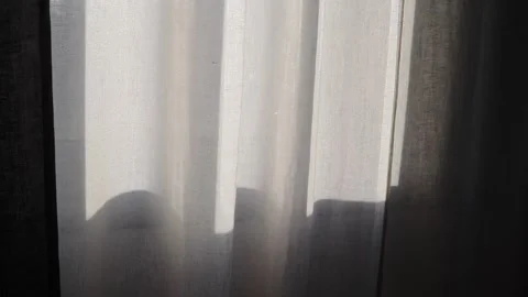 Sunlight patch on white linen curtain by window Stock Footage 329174100