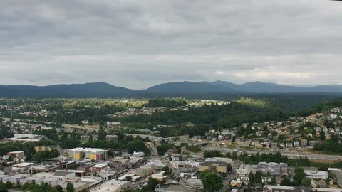 Sunlight Peeking through the clouds on a Gloomy Day, Seattle Suburbs Stock Footage 114412929