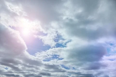 Sunlight peeks through moving clouds Foto stock