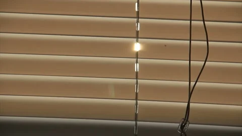 The sunlight penetrates through the blinds Stock Footage 170749504