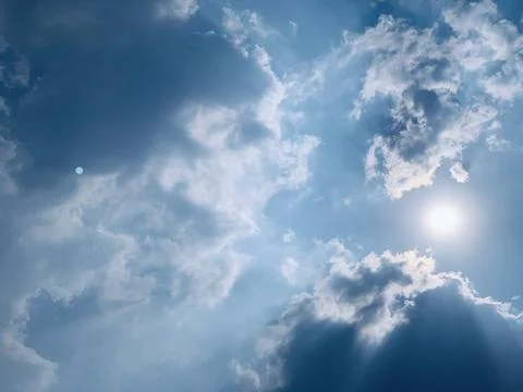 Sunlight Piercing Through Dramatic Clouds in an Atmospheric Sky Stock Photos