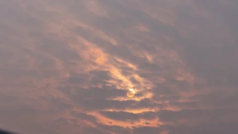 Sunlight Radiating Through Dense Surging Clouds in Dramatic Golden Hour Sunset Stock Footage 341999137