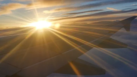 Sunlight rays against wing of airplane	 Stock Footage 97408342