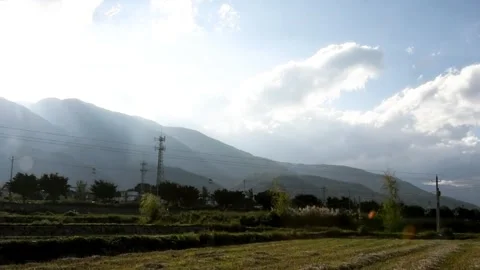 Sunlight rays beaming over mountain landscape views. Stock Footage 336333795