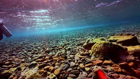 Sunlight Rays Refracting Over Shallow Pebble Seabed - Freshwater River Bed Stock Footage 347049890