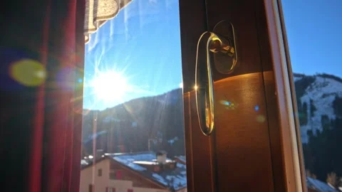 Sunlight rays streaming through open wooden window frame overlooking scenic.. Stock Footage 339510469