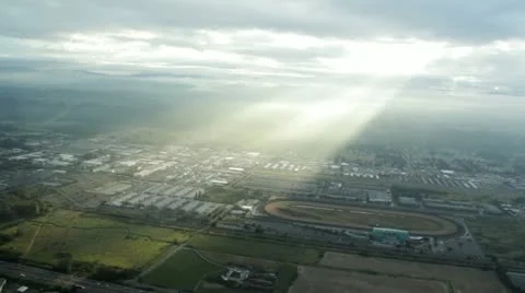 Sunlight Rays Through Clouds Over Urban Area Stock Footage 12422813