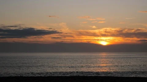 Sunlight reflected on ocean at sunset in Portugal, as the sun descends Video stock 116364880