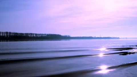 Sunlight is reflected sparkling in the lake water waves - real time Stock Footage 137703003