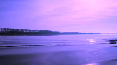 Sunlight is reflected sparkling in the lake water waves - slow motion Stock Footage 137703590