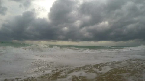 Sunlight reflected on wavy sea at coast Stock Footage 130431147