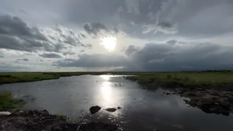 Sunlight Reflecting on a River Winding Through Qinghai Wetlands, China Vídeos de archivo 337079706