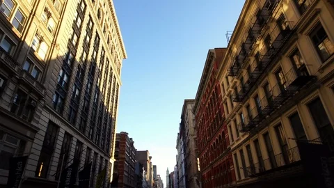 Sunlight reflecting in row of buildings in Soho NYC New York City Manhattan  Stock Footage 95961097
