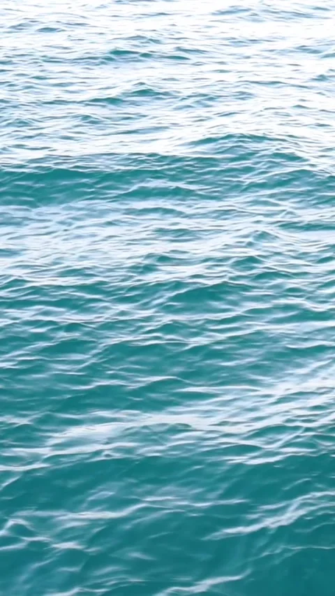 Sunlight Reflecting on Turquoise Ocean Water Surface Stock Footage 345843361